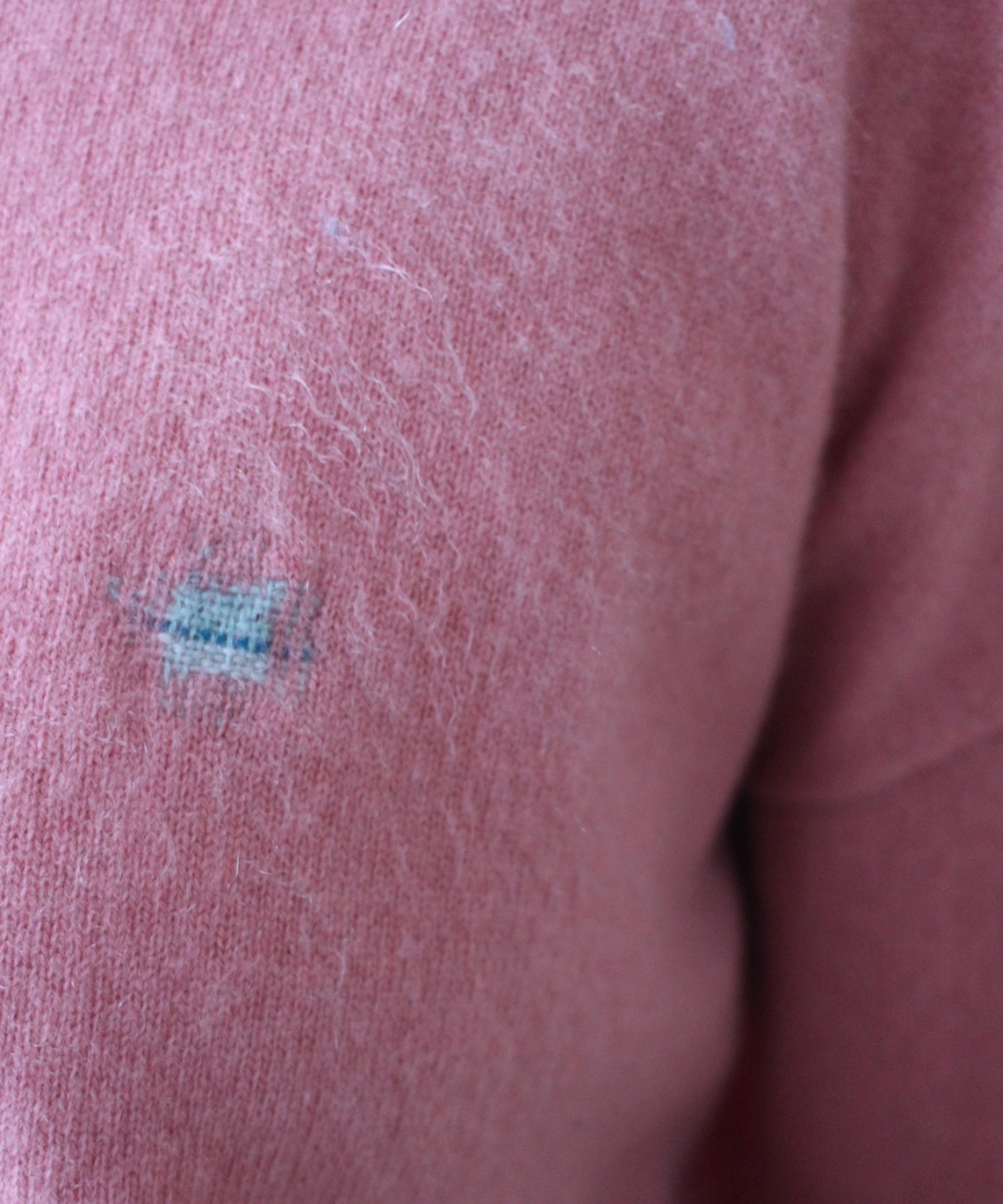 Visibly mended cashmere cardigan