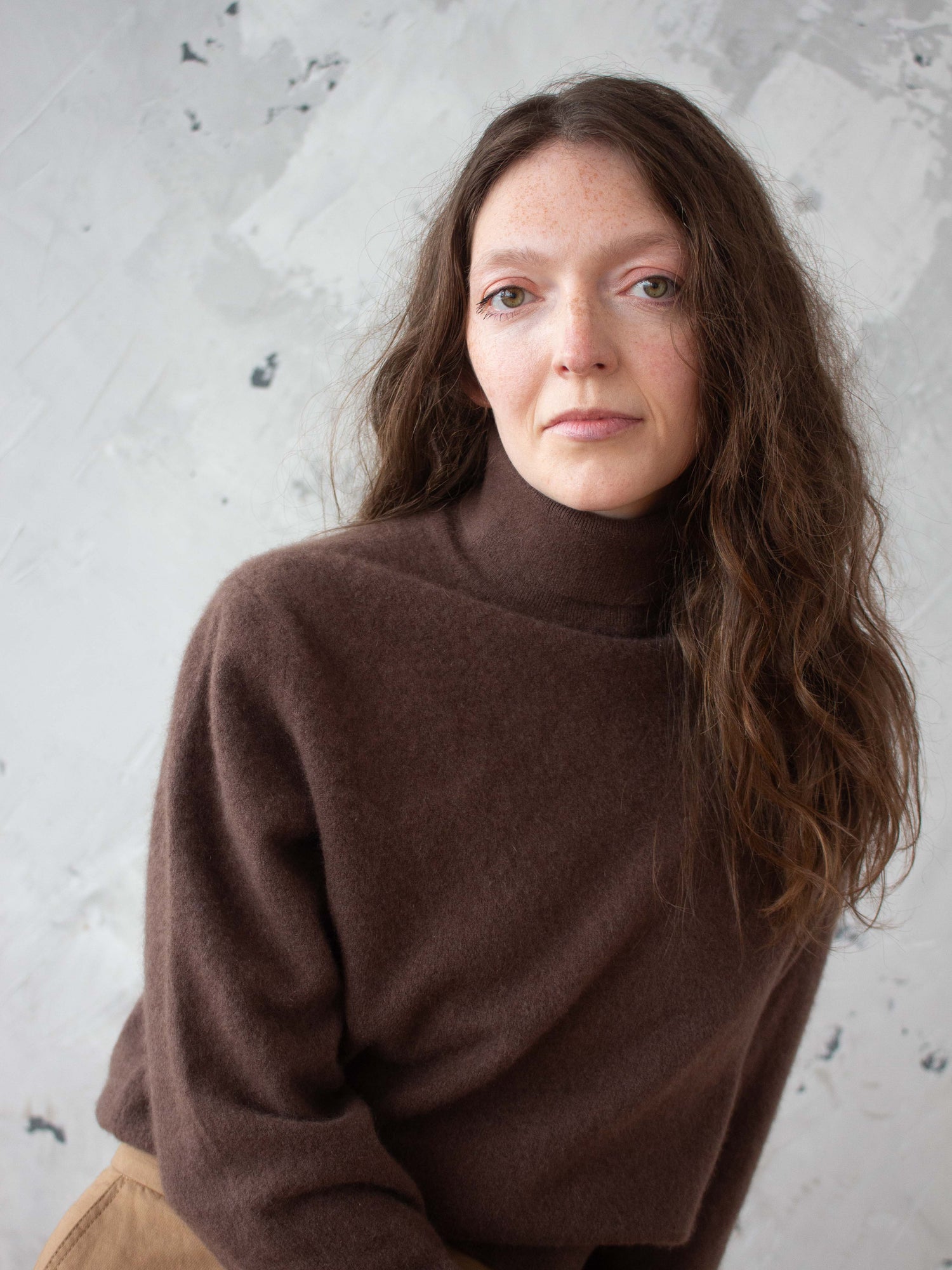 Woman wearing secondhand cashmere jumper