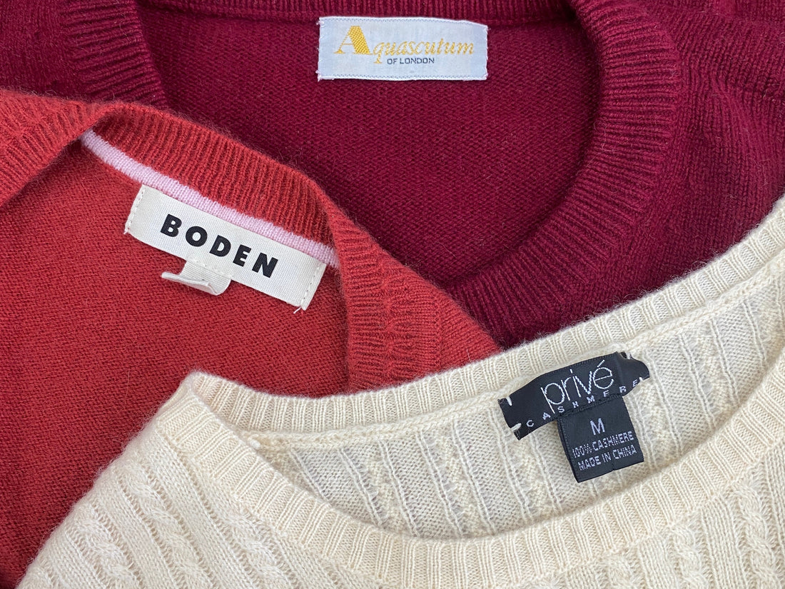 Flat lay of secondhand cashmere jumpers