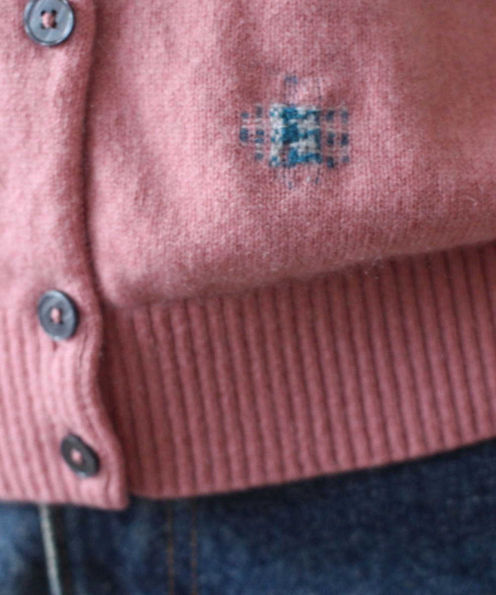 Visibly mended cashmere cardigan