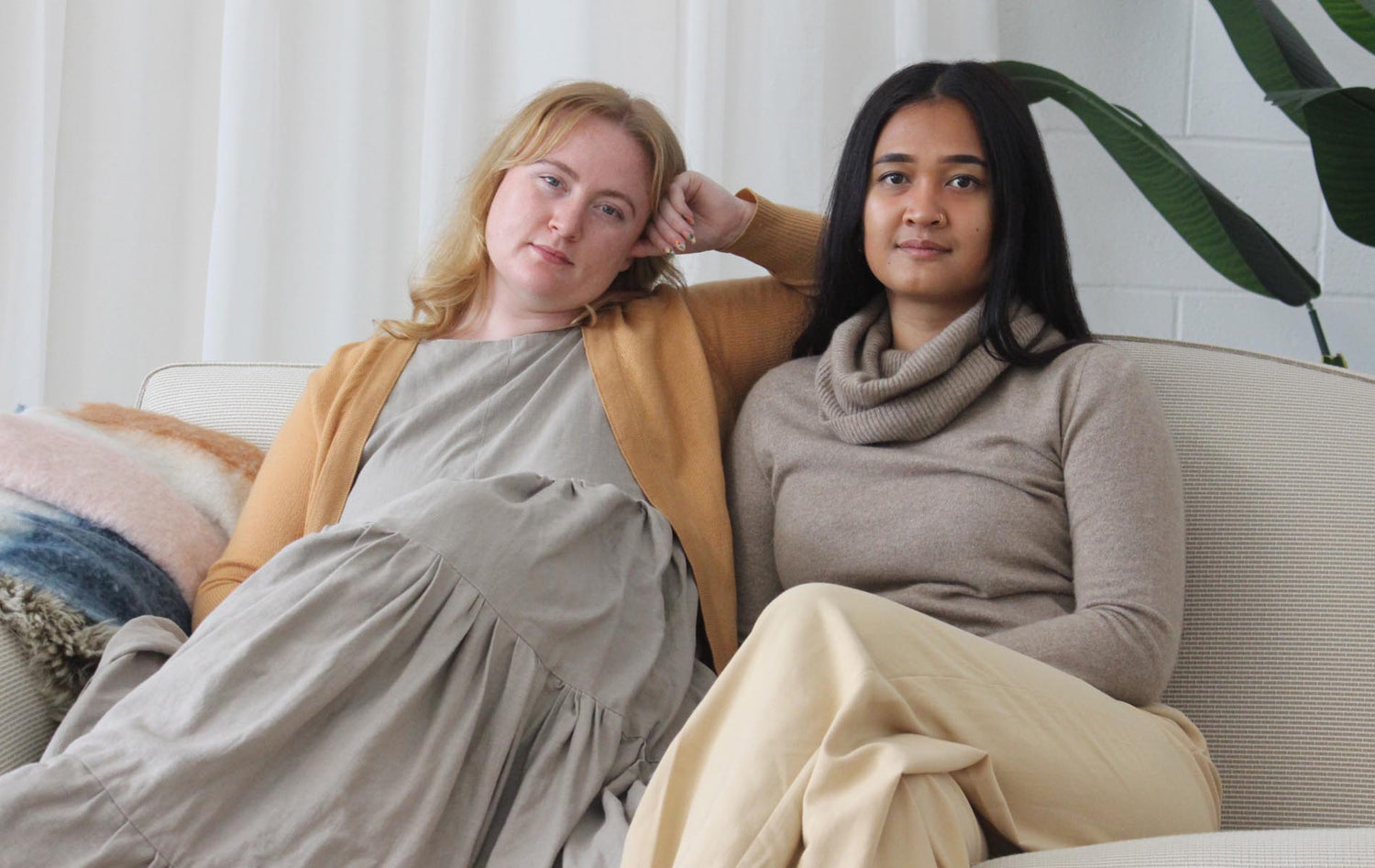 Two women wearing cashmere jumpers