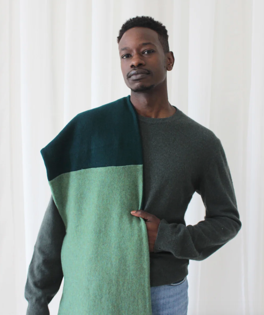 Man wearing green reclaimed cashmere scarf