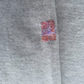 A visible mend on a cashmere jumper
