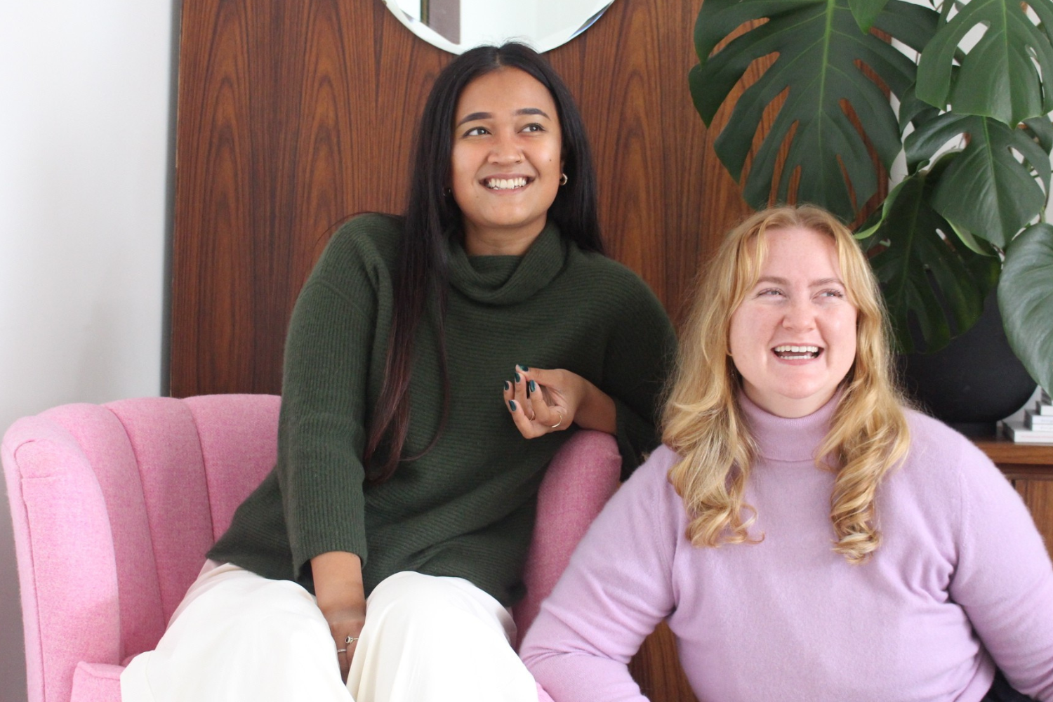 Two women wearing cashmere jumpers